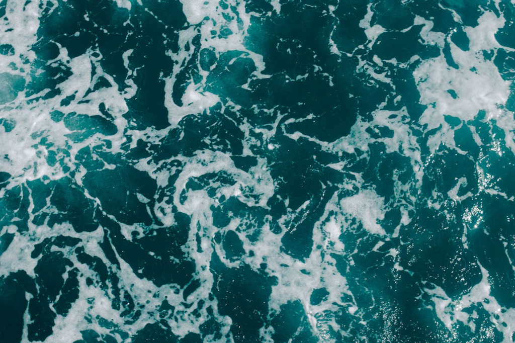 The Art of Drawing Readers In: Your attractive post title goes here Dynamic aerial photograph of ocean waves with foamy textures, showcasing sea patterns.
